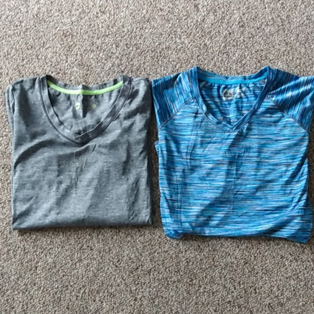 Women's long sleeve performance shirts. Size Medium. Price by the piece.